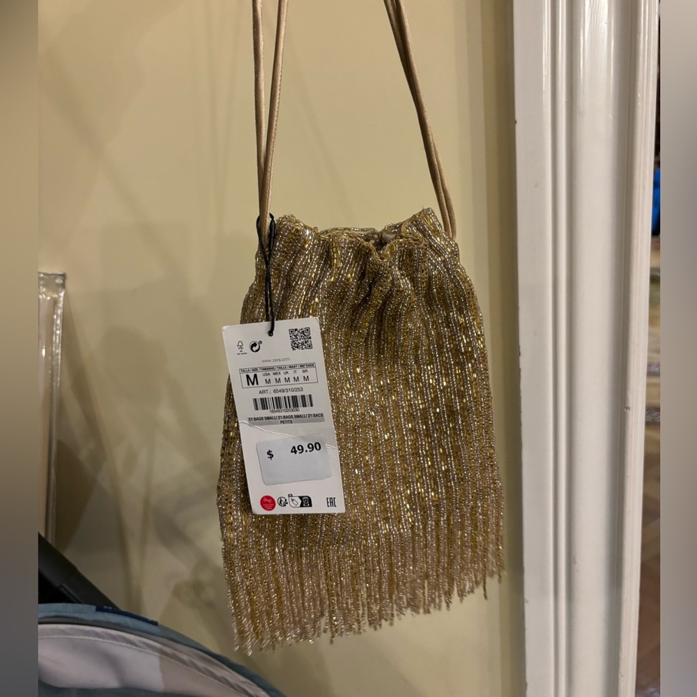 Zara gold beaded night bag with fridges.